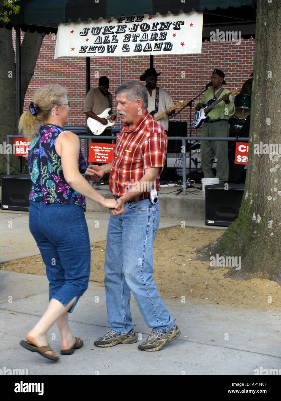 Couple dancing to blues band in Handy Park Beale Street Memphis USA Stock Photo