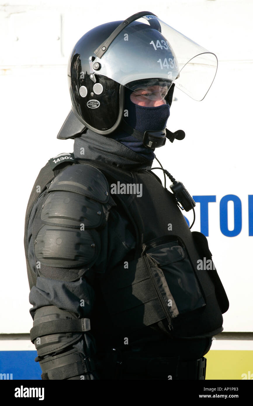 PSNI officer in ninja riot gear on crumlin road at ardoyne shops belfast 12th July Stock Photo