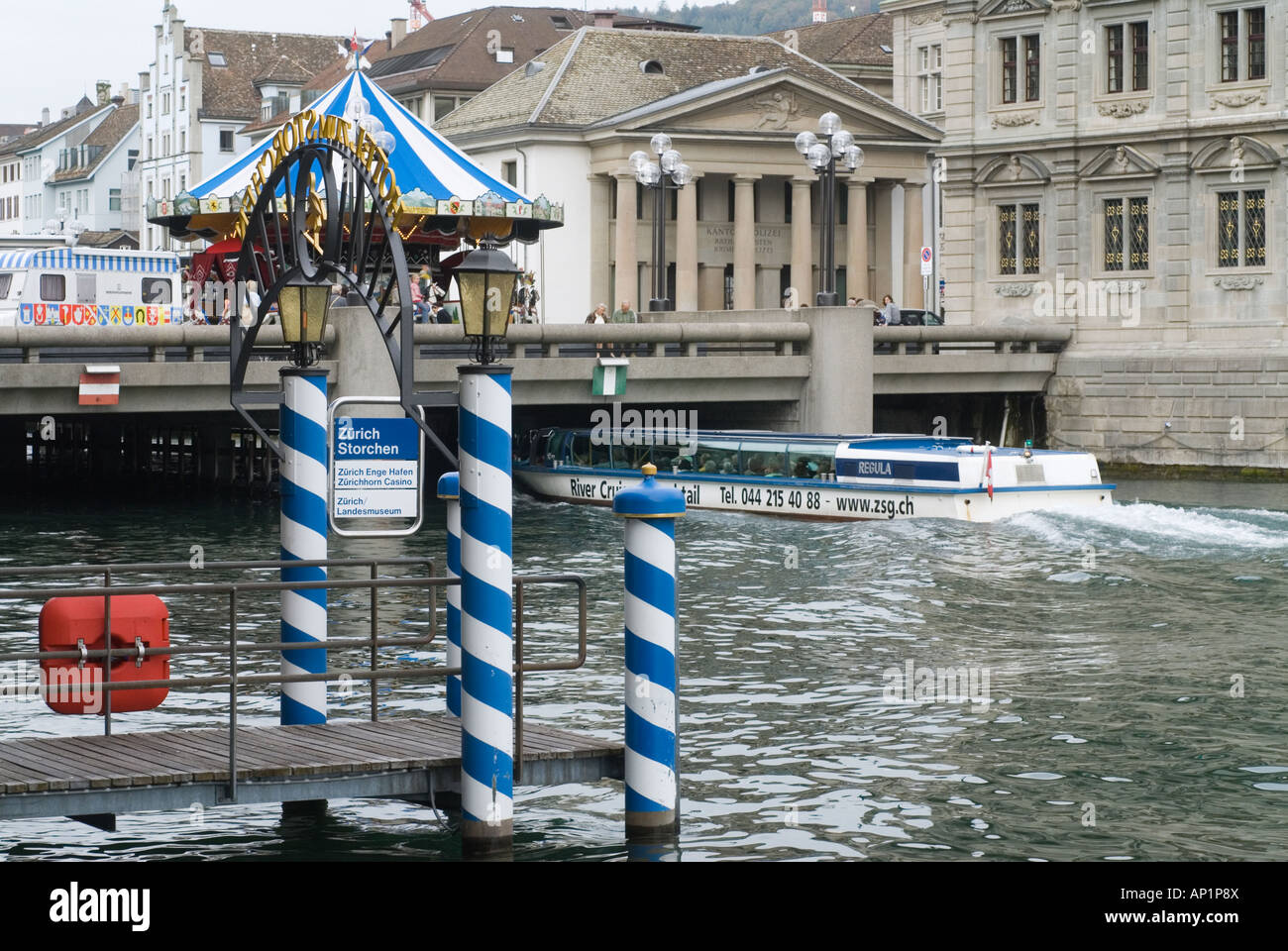 Limmat River in Zurich, Switzerland with dock of the Hotel zum Storchen and sightseeing boat. Stock Photo