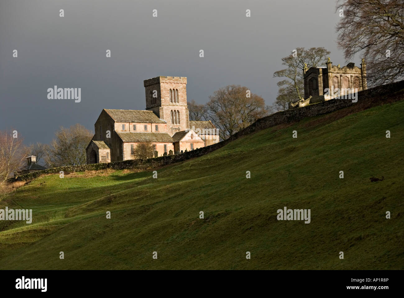 Lowther Castle, Cumbria, UK. St Michael's Church, 1686. Dramatic light on a stormy winter day Stock Photo