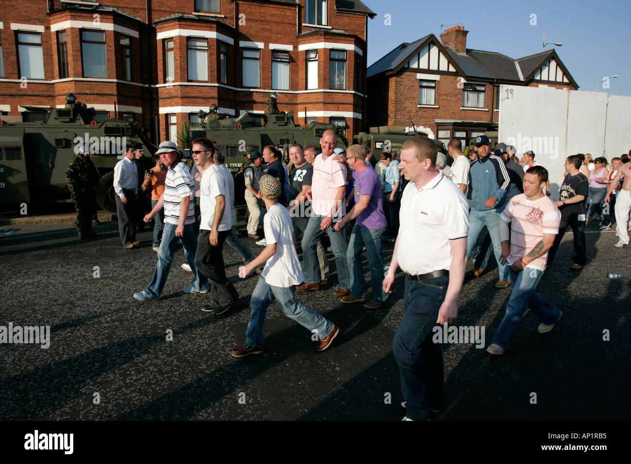 loyalist thugs hangers on marching on crumlin road at ardoyne shops belfast 12th July Stock Photo