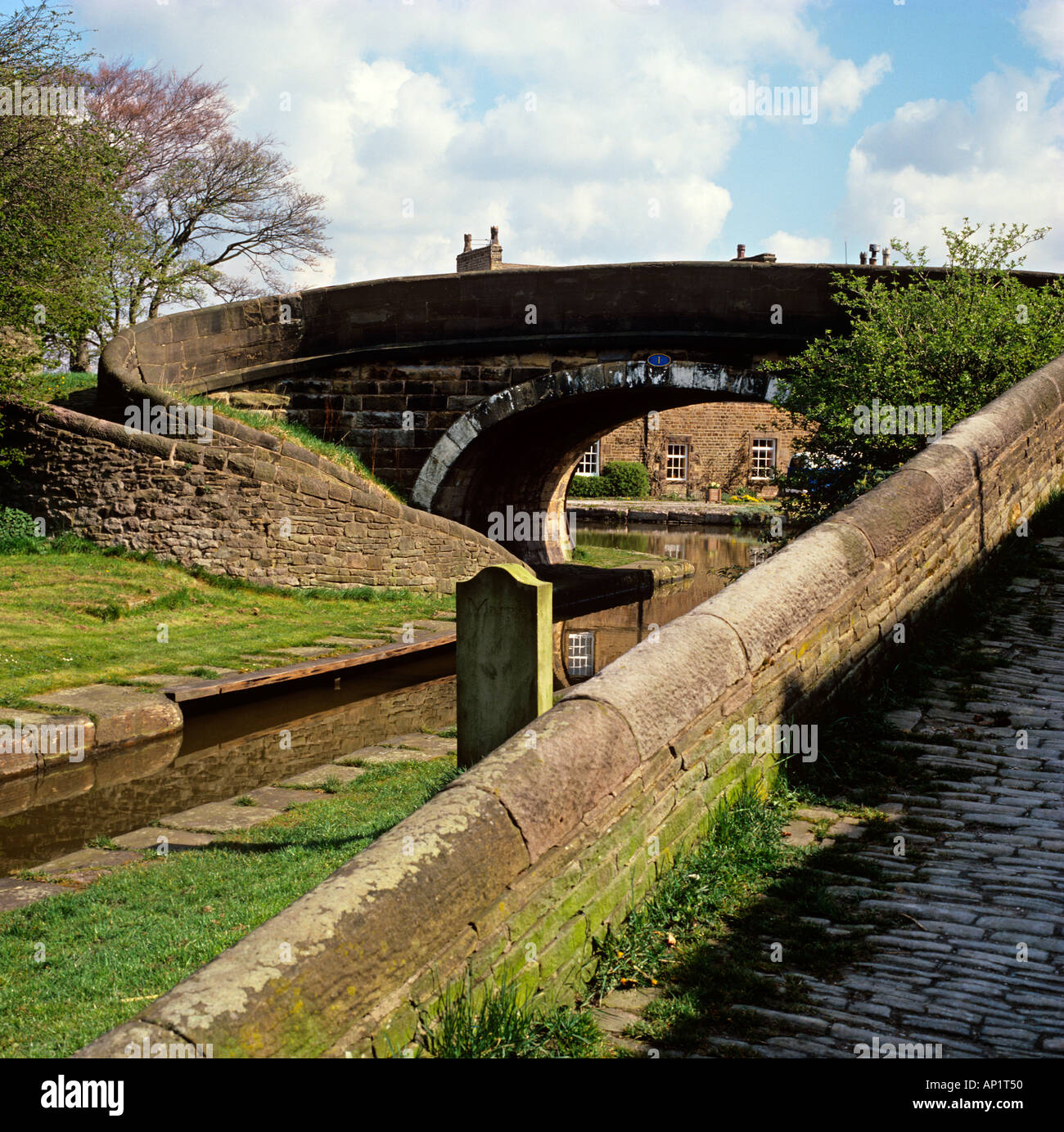 Cheshire Stockport Marple Bridge circular bridge crossing Macclesfield Canal towpaths Stock Photo