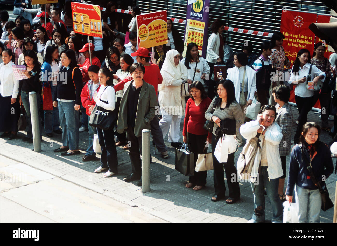 People standing on a pavement, Hong Kong, China Stock Photo