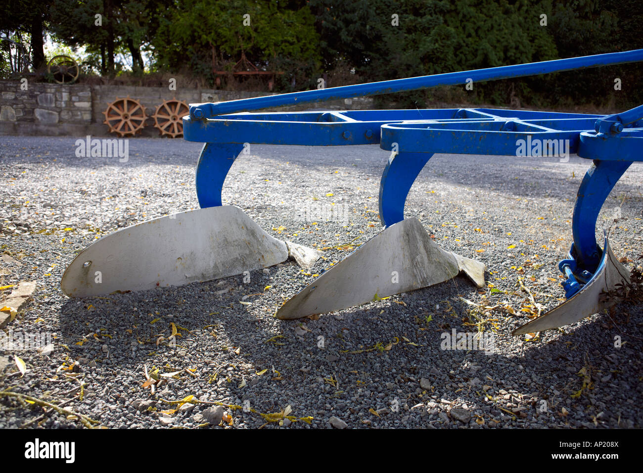 Old Plough on gravel path Wiltshire England English farming Stock Photo