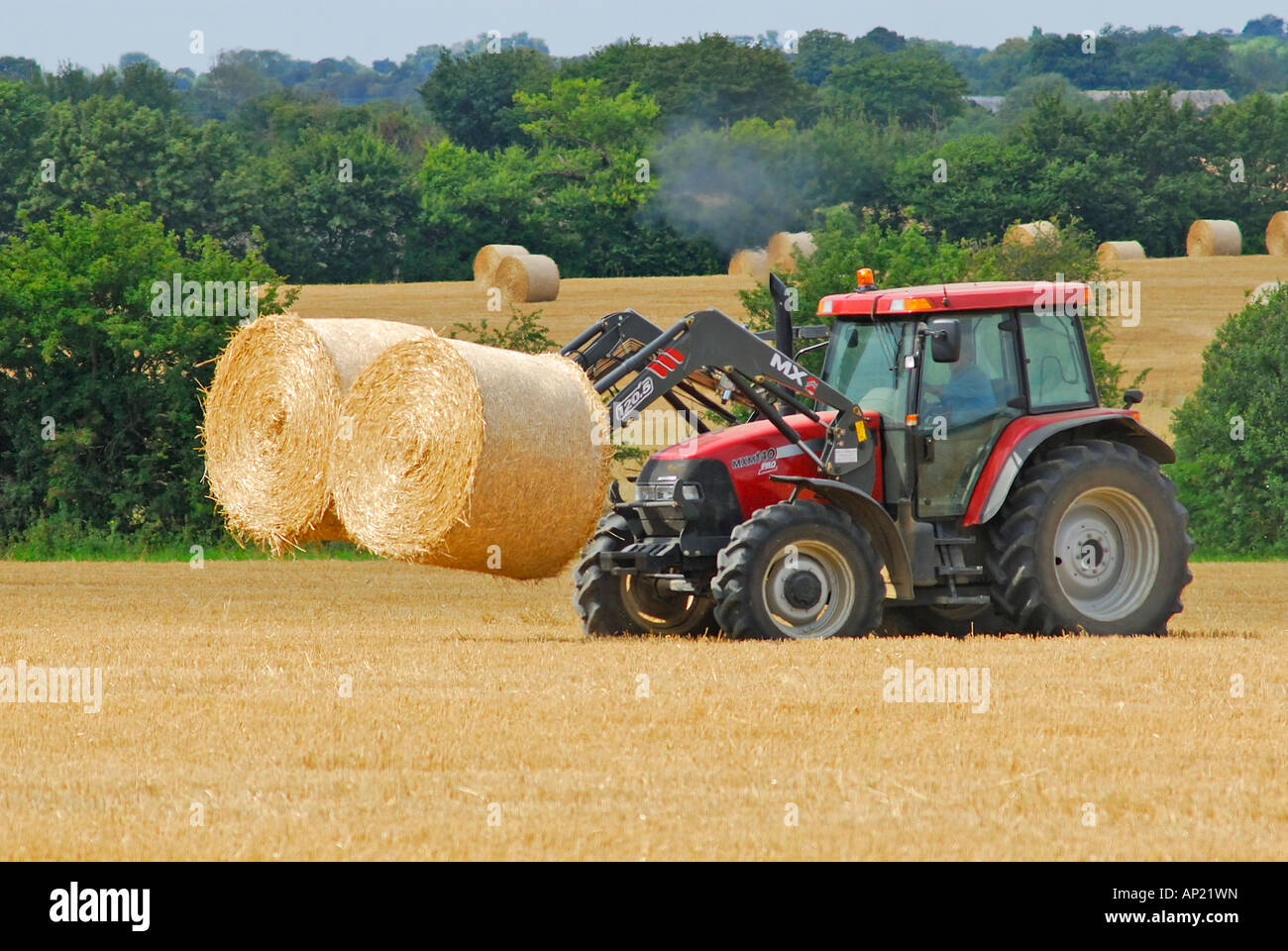 Hay bails being collected, Essex, UK Stock Photo