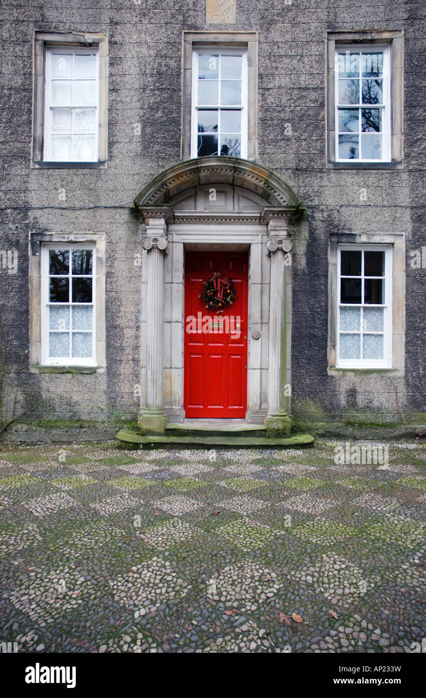Georgian House With Red Front Door And Christmas Wreath Stock