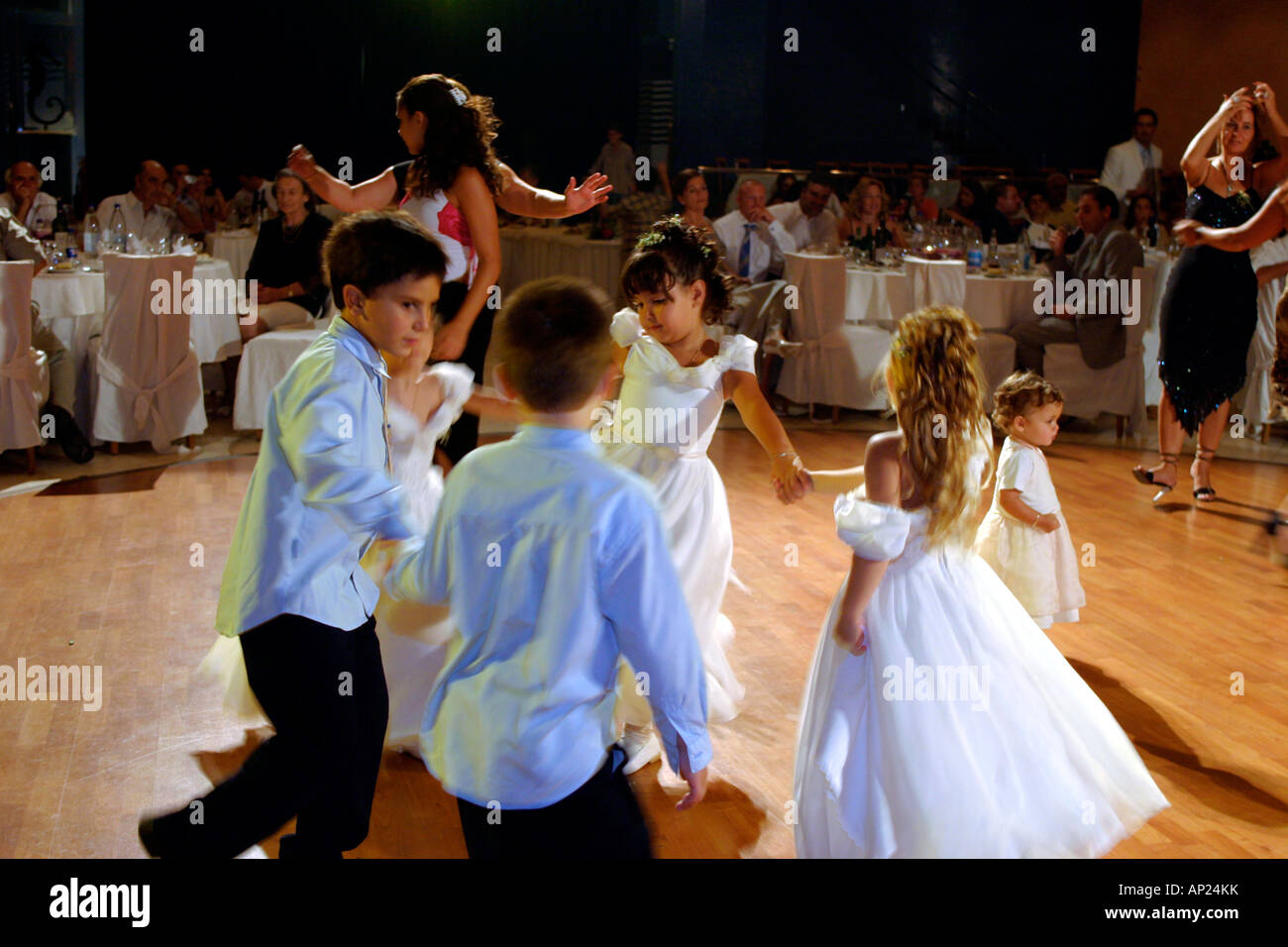 greece a group of children dancing at a traditional greek wedding celebration Stock Photo