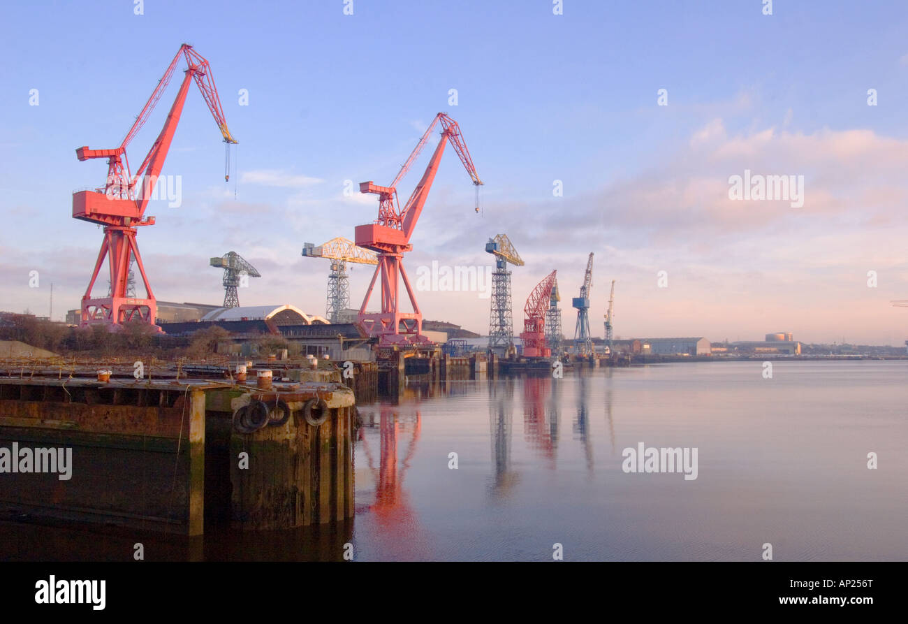 Cranes at Swan Hunters Shipyards reflected in the river Tyne at Wallsend England Stock Photo