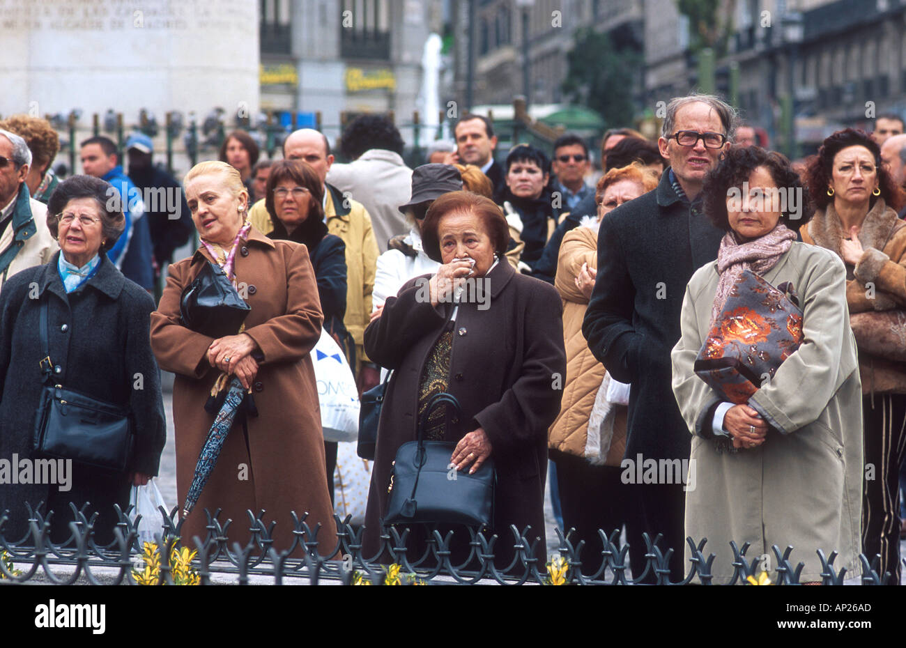 People mourning at the Memorial service for the Madrid train bombings