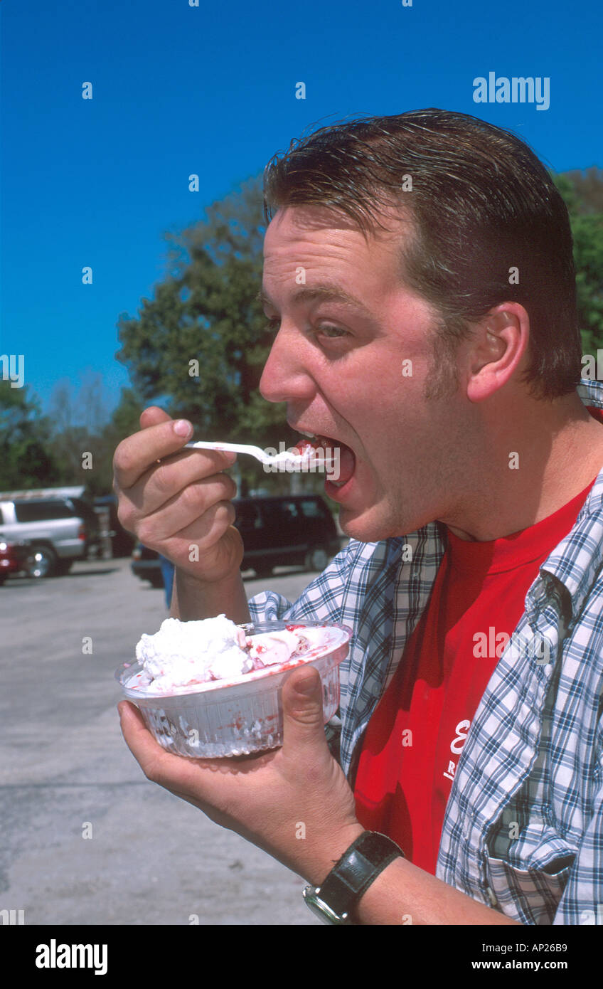 Man eating strawberry shortcake at Parker Farms in Plant City Florida  Stock Photo