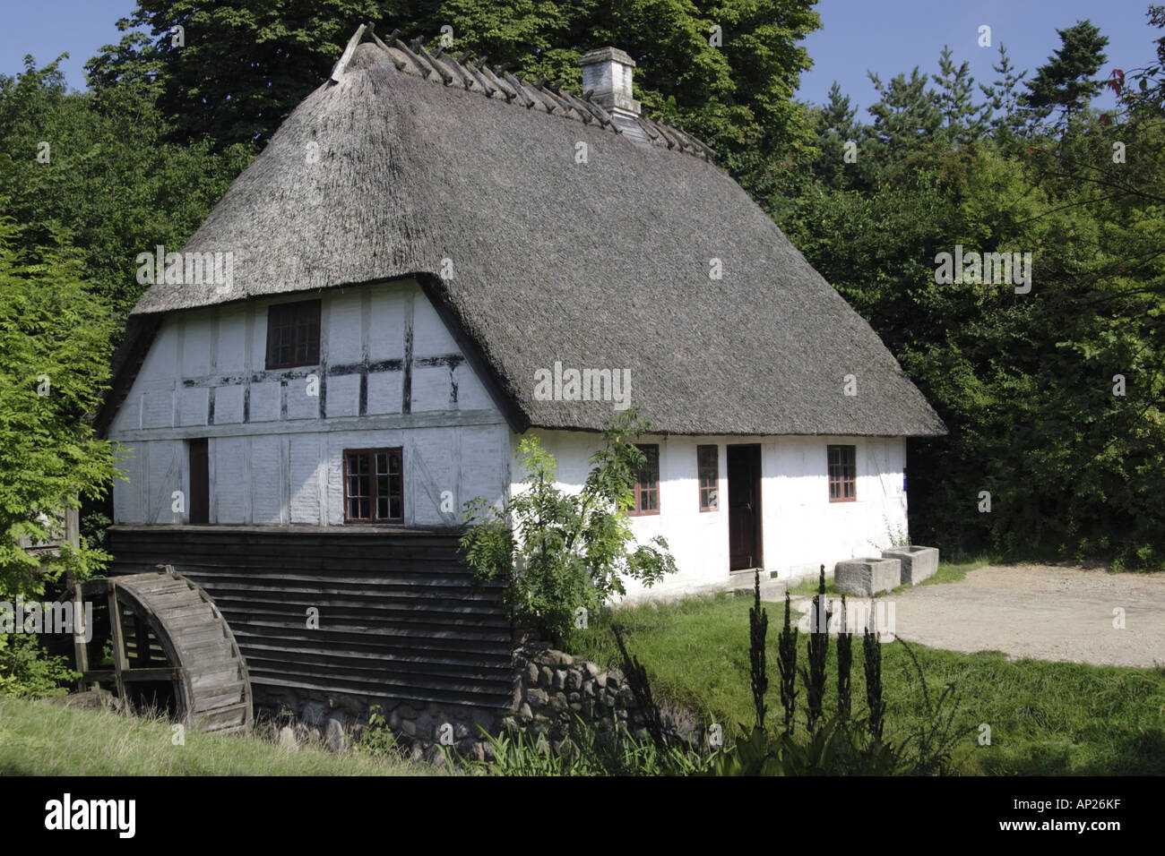 Thatched cottage withwater wheel at the Old Town Museum Den Gamle By, Arhus Denmark Stock Photo