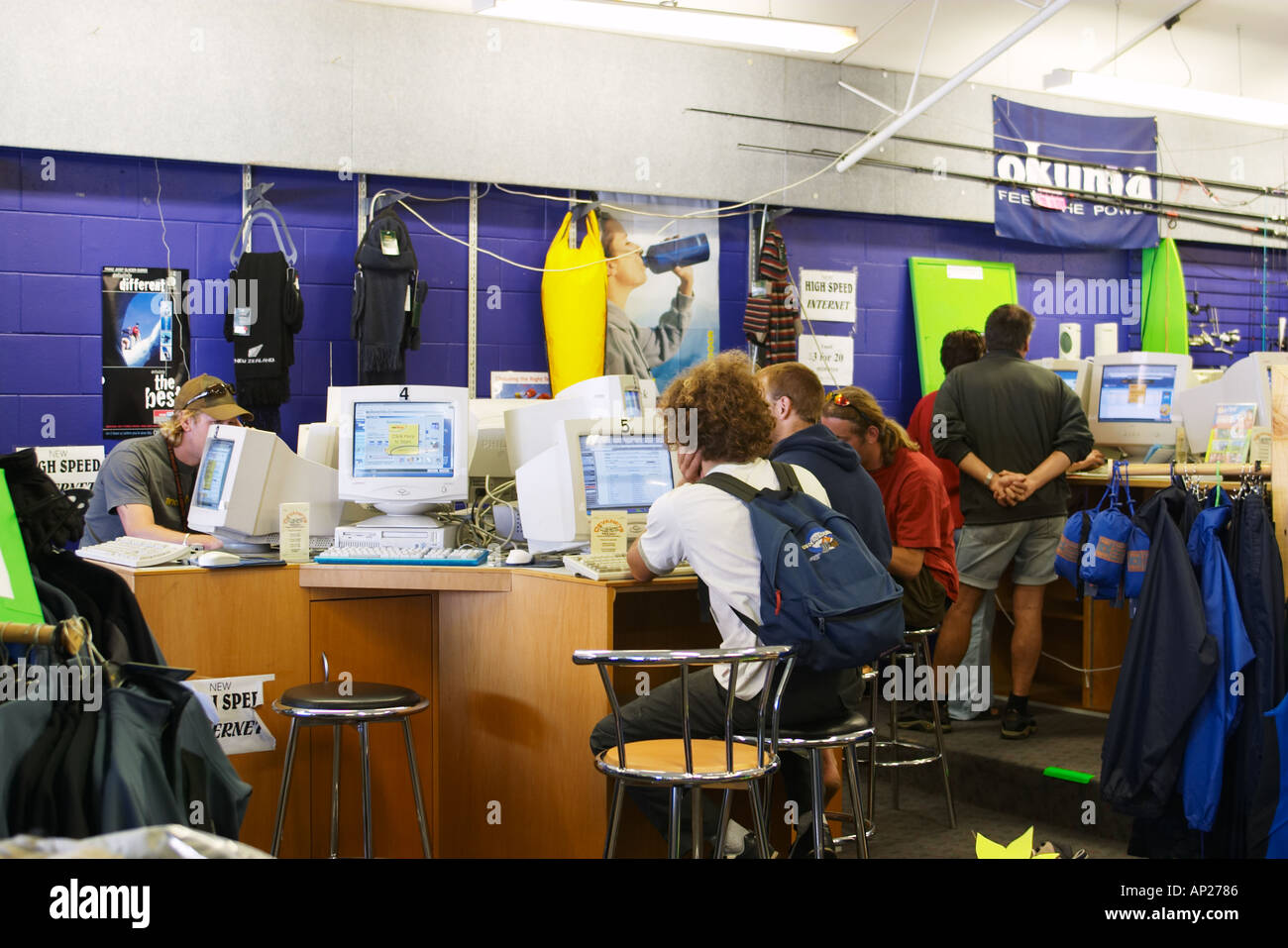 NEW ZEALAND Hokitika cafe in sporting goods store young people at computer terminals