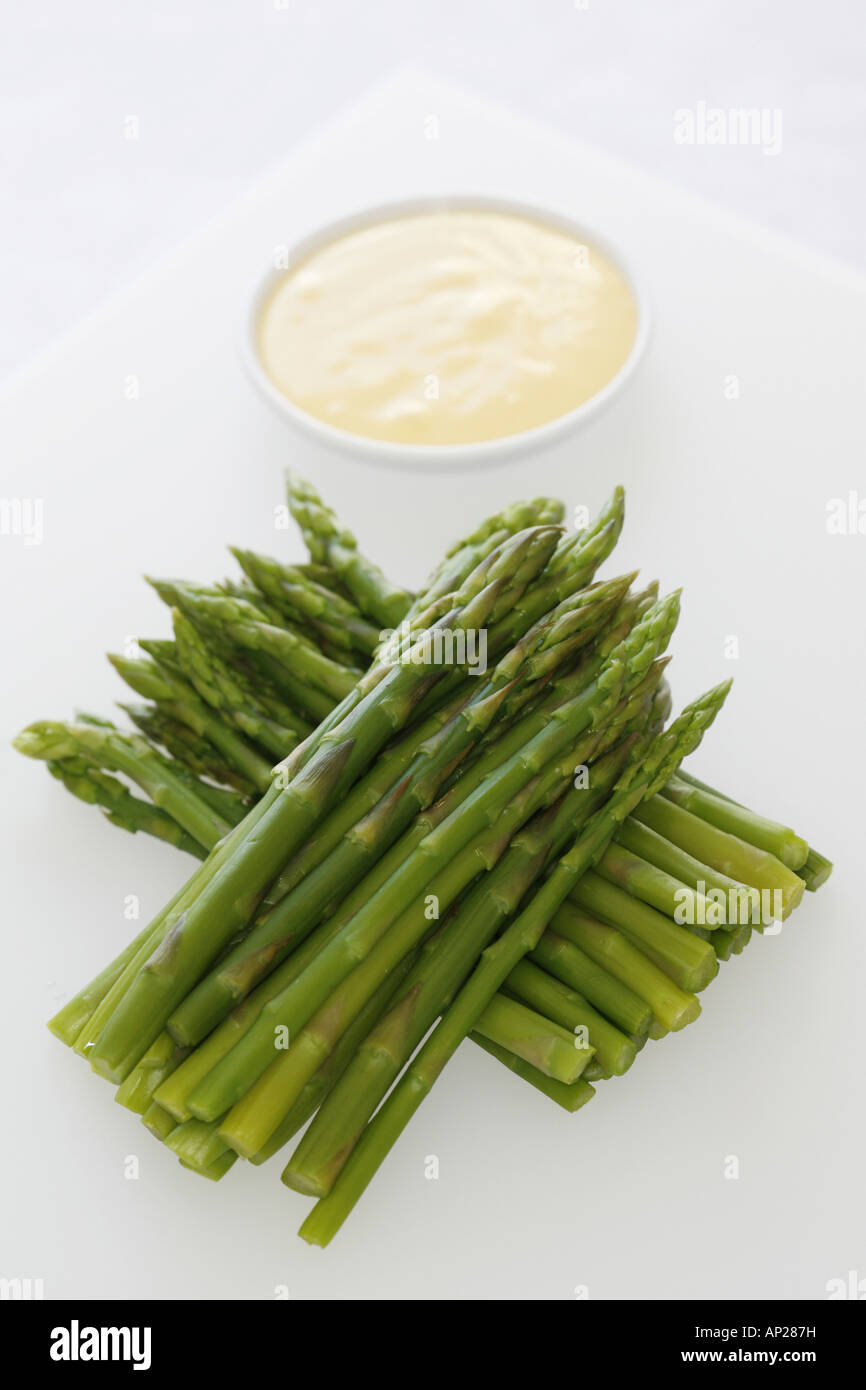 Asparagus on a platye with hollandaise sauce dip Stock Photo Alamy