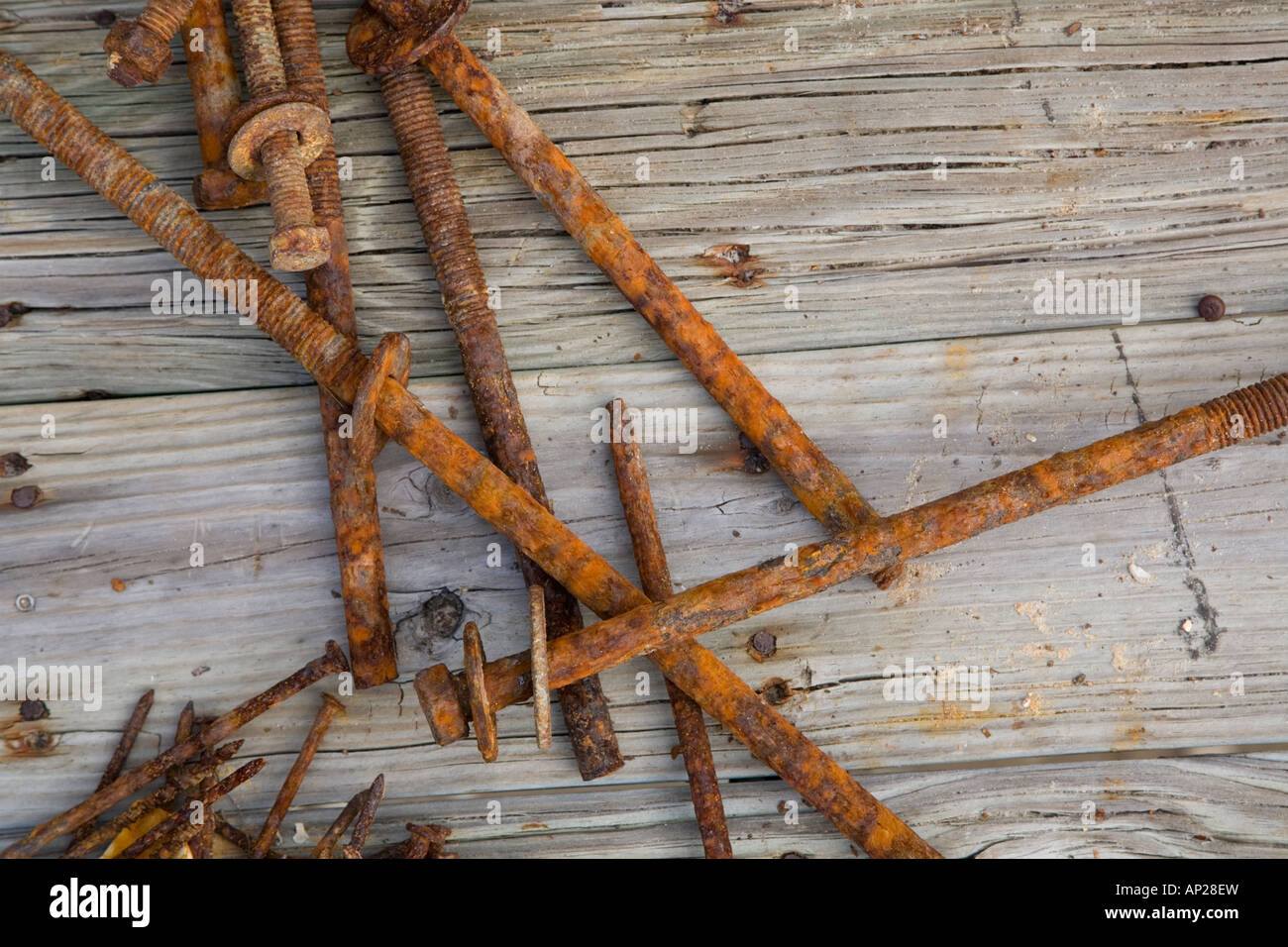 Rusty nails laying on weathered wood Stock Photo Alamy