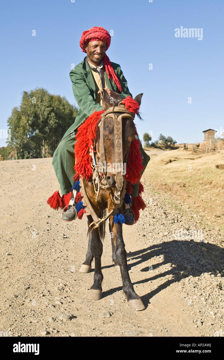 Travelling through north Ethiopia this local man was happy and proud to pose on his horse and traditional dress. Stock Photo