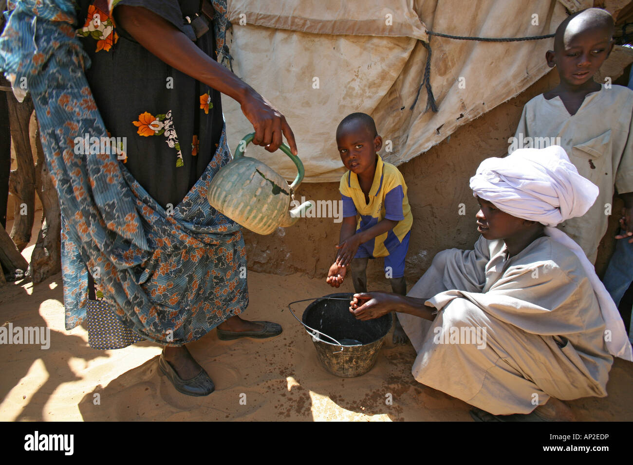 Refugee family from Darfur living in Bahai refugee camp in Chad where they find safety from the war in Sudan Stock Photo