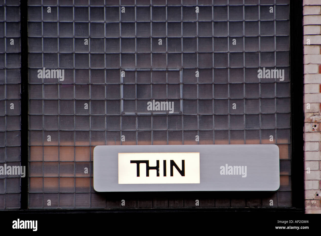 Sign on Building Thin Stock Photo
