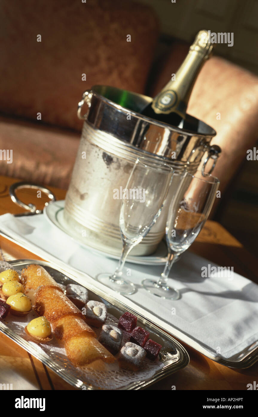 Room Service Bottle Of Champagne And Two Glasses In Hotel
