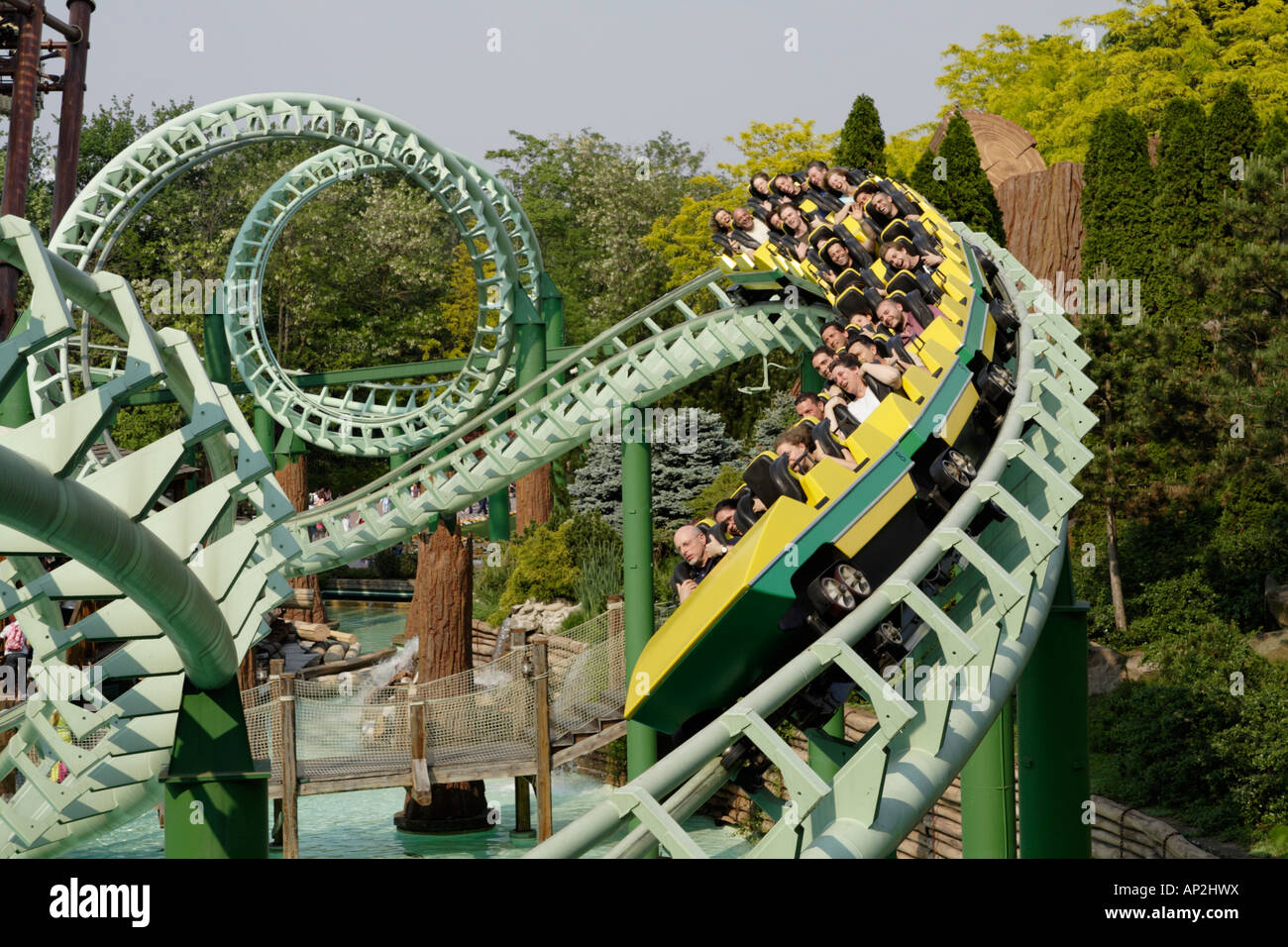 Seminar graphic Glad People ride a rollercoaster, theme park in Italy Stock Photo - Alamy