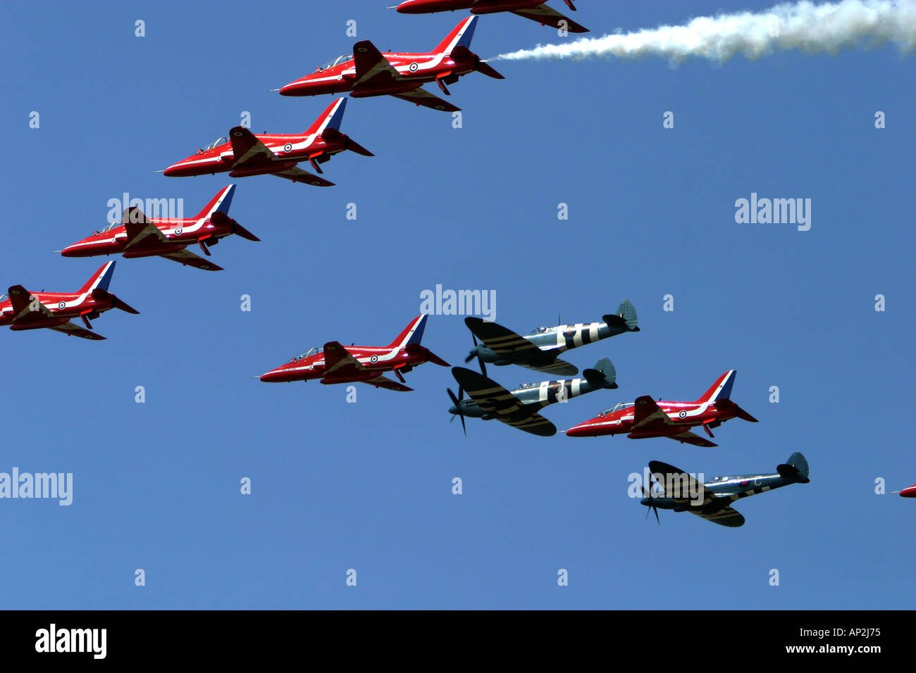 The famous Red Arrows with Spitfires in Battle of Britain flypast Stock Photo