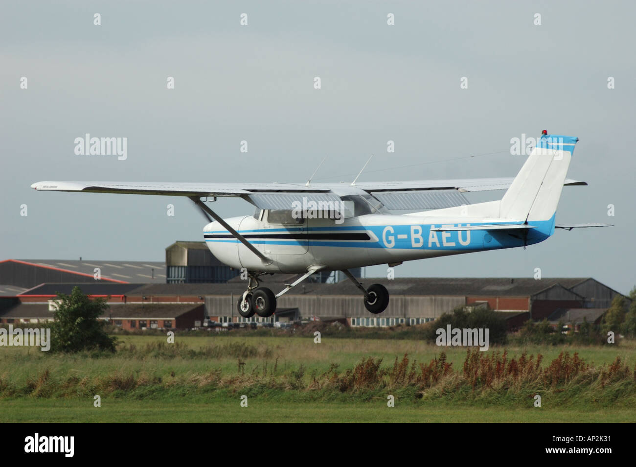 A small Cessna light aircraft comes in for landing at Sandoft Airfield in Lincolnshire UK Stock Photo