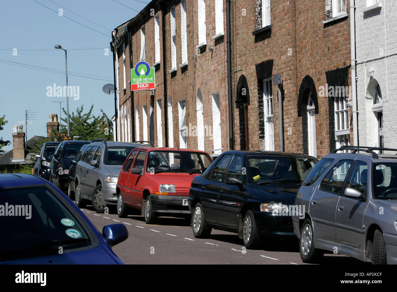 Terraced houses in Taunton with crowded parked cars Stock Photo Alamy