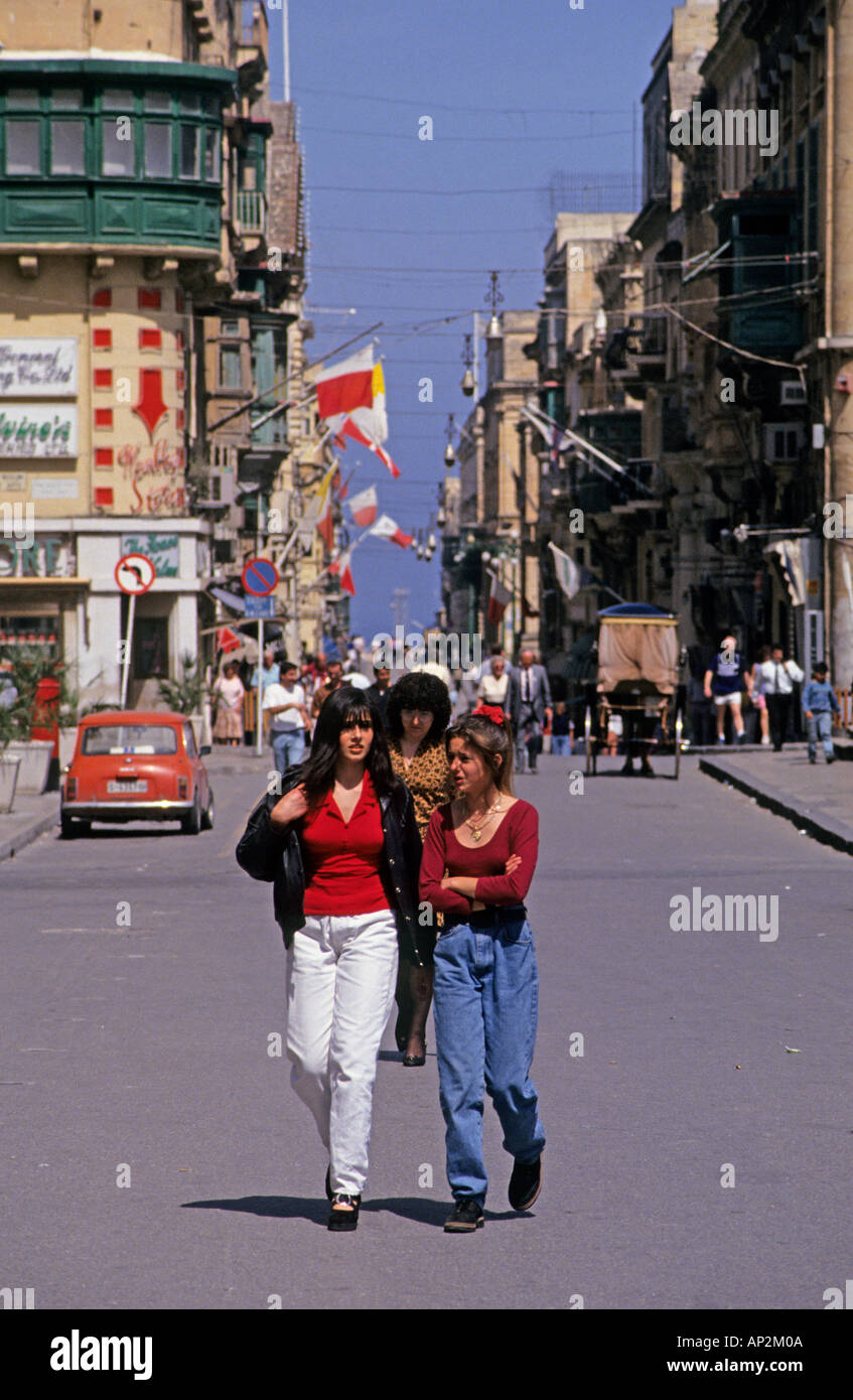 Girls walking in the main street in Valletta Malta Europe Stock Photo