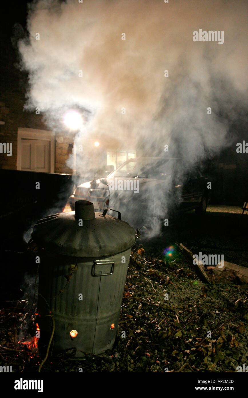 Burning rubbish in a garden incinerator Stock Photo Alamy