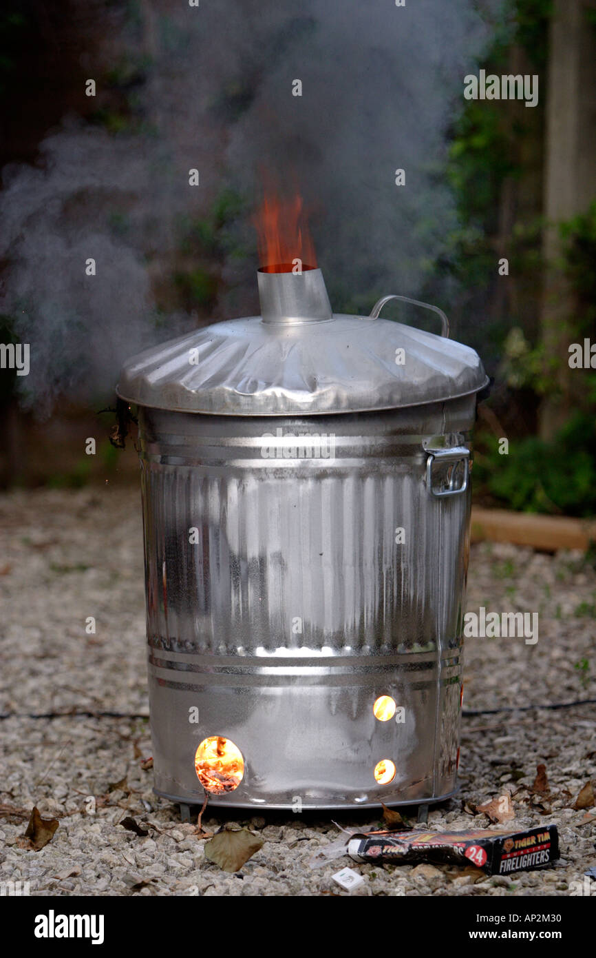Burning rubbish in a garden incinerator Stock Photo Alamy