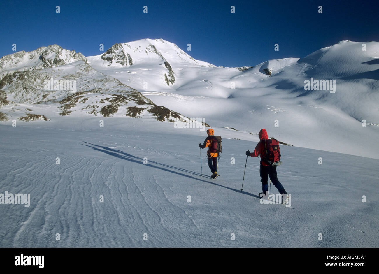 two mountaineerers on their way to glacier Hintereisferner beneath Weisskugel, Oetztal range, Tyrol, Austria Stock Photo