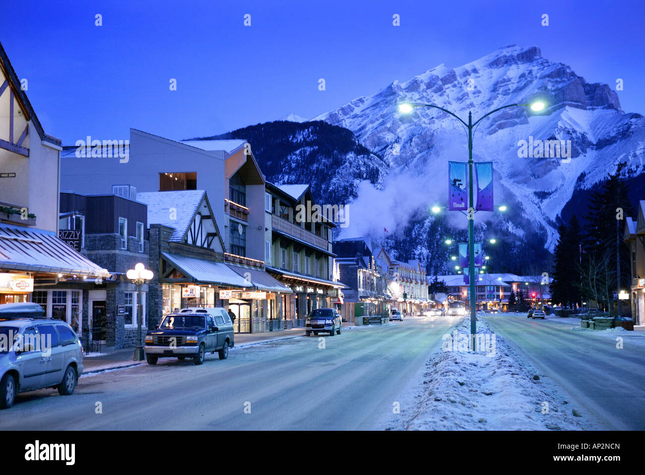 Banff avenue in the morning light with Cascade mountain in the background, Snow, Winter, Alberta, Canada Stock Photo