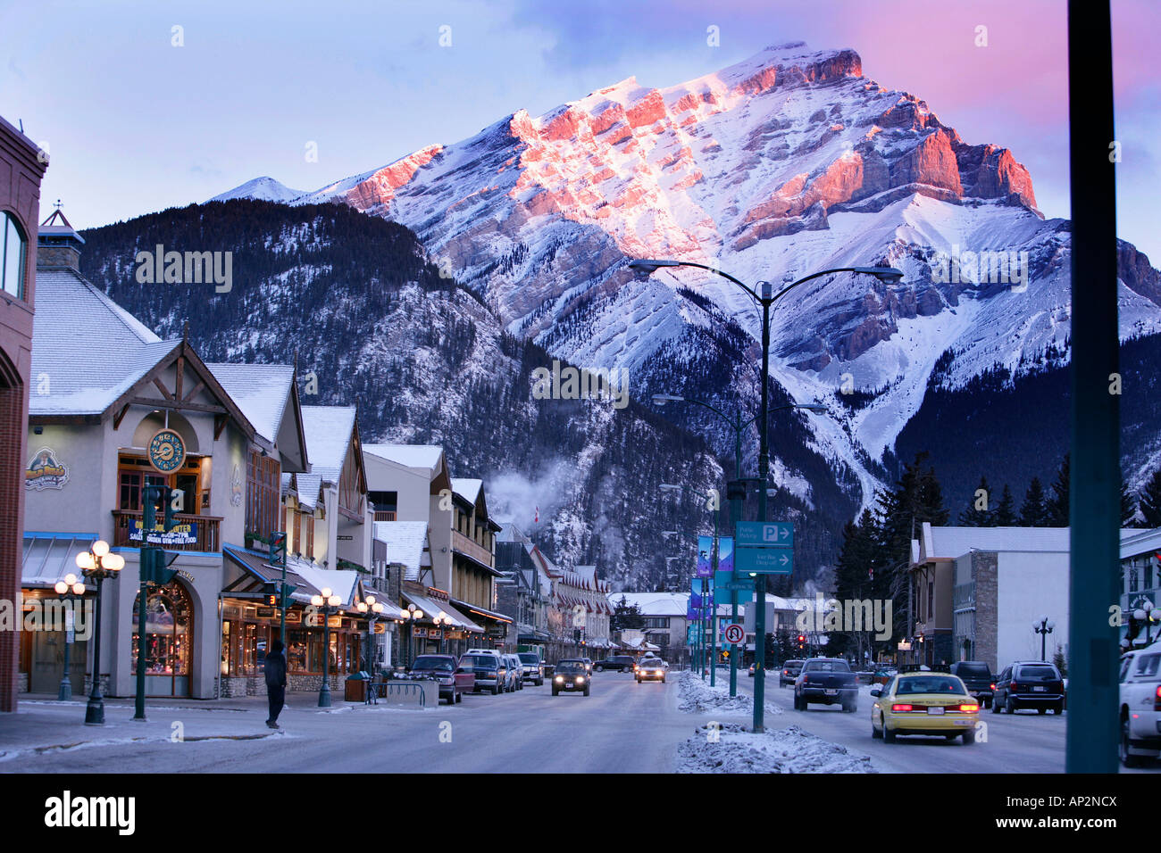 Banff avenue in the morning light with Cascade mountain in the background, Snow, Winter, Alberta, Canada Stock Photo