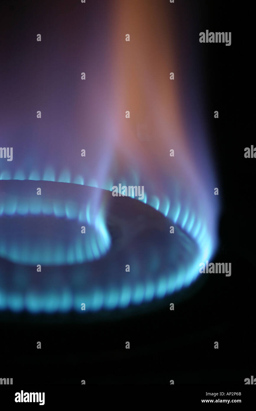 Burning fuel LPG bluish color bright flame two circles on cooking gas range stove in modern new kitchen in India Stock Photo