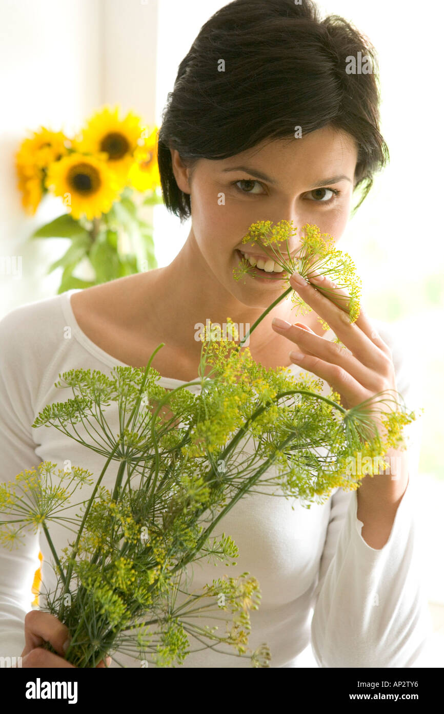 woman sniffing fennel Stock Photo Alamy