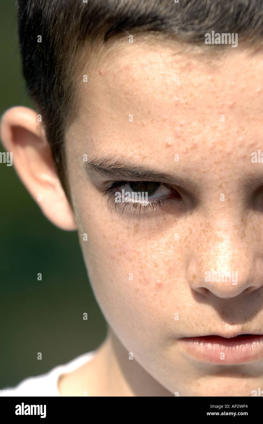 teenage boy twelve portrait threatening dissaffected youth male boy lad kid child children one single individual  Stock Photo