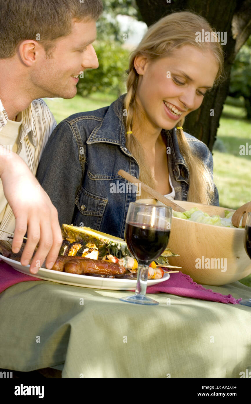 Smiling girl having dinner friend hi-res stock photography and images ...
