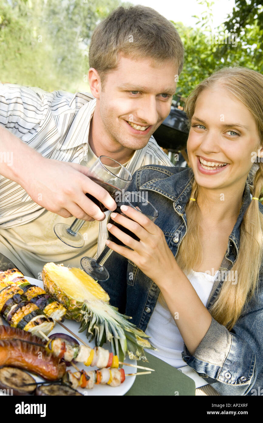 couple having barbecue Stock Photo - Alamy
