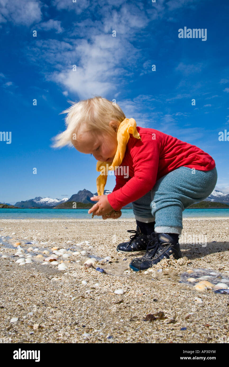 A child, girl collecting sea shells on the beach of Store Molla Stock Photo Alamy