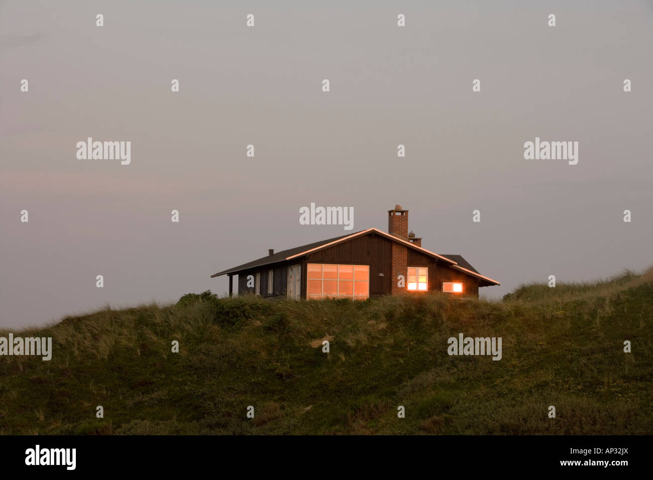 Sunset Reflection in Vacation Home Window, Henne Strand, Central Jutland, Denmark Stock Photo