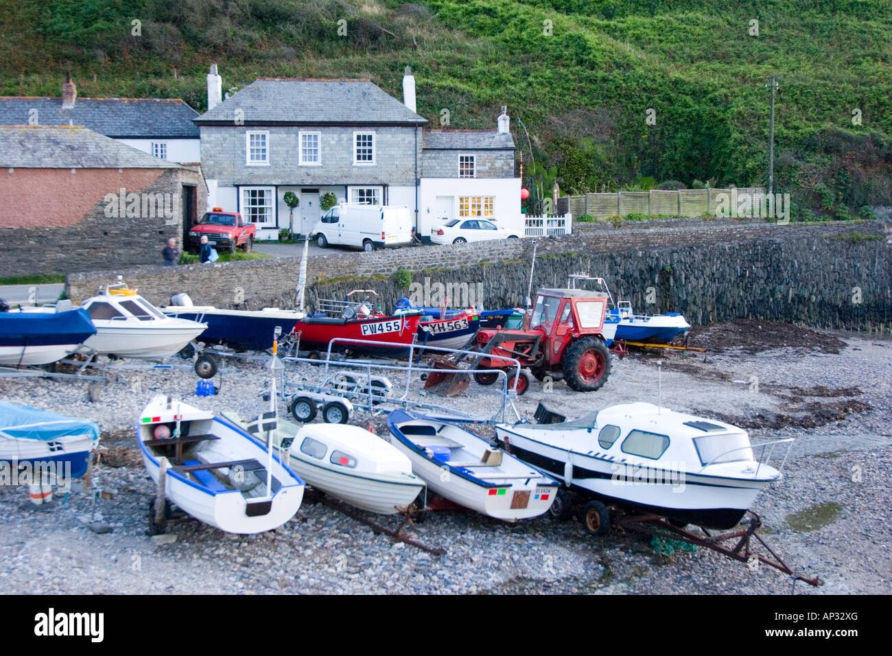 The beach harbour and cottages in Port Gaverne Cornwall Stock Photo Alamy