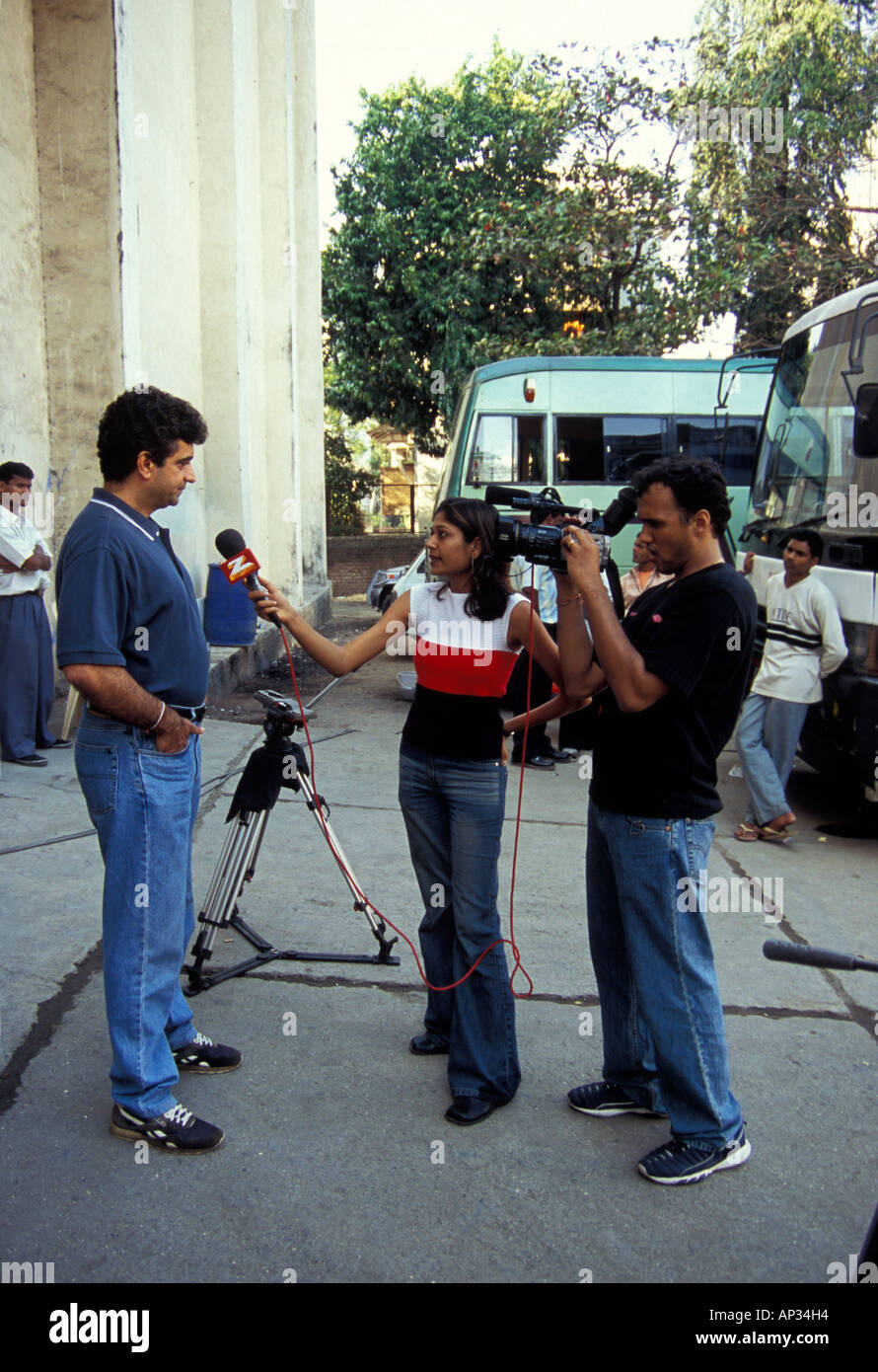 Indian Director Indra Kumar being interviewed by Zee TV during a break for filming Bollywood film 'Masti', Mumbai, South India Stock Photo