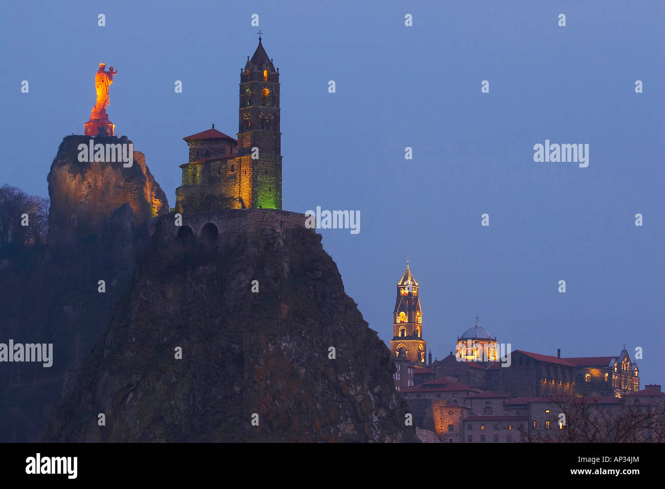 Evening view of cathedral Notre-Dame du Puy, Rocher Corneille with statue Notre-Dame de France, Chapelle St. Michel d'Aiguilhe, Stock Photo