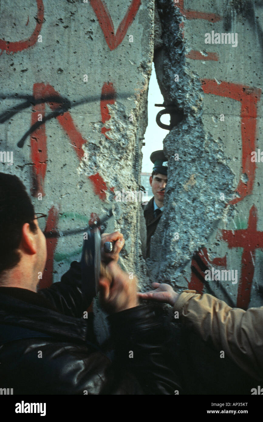 The Berlin Wall, knocking it down, hole in the wall Stock Photo