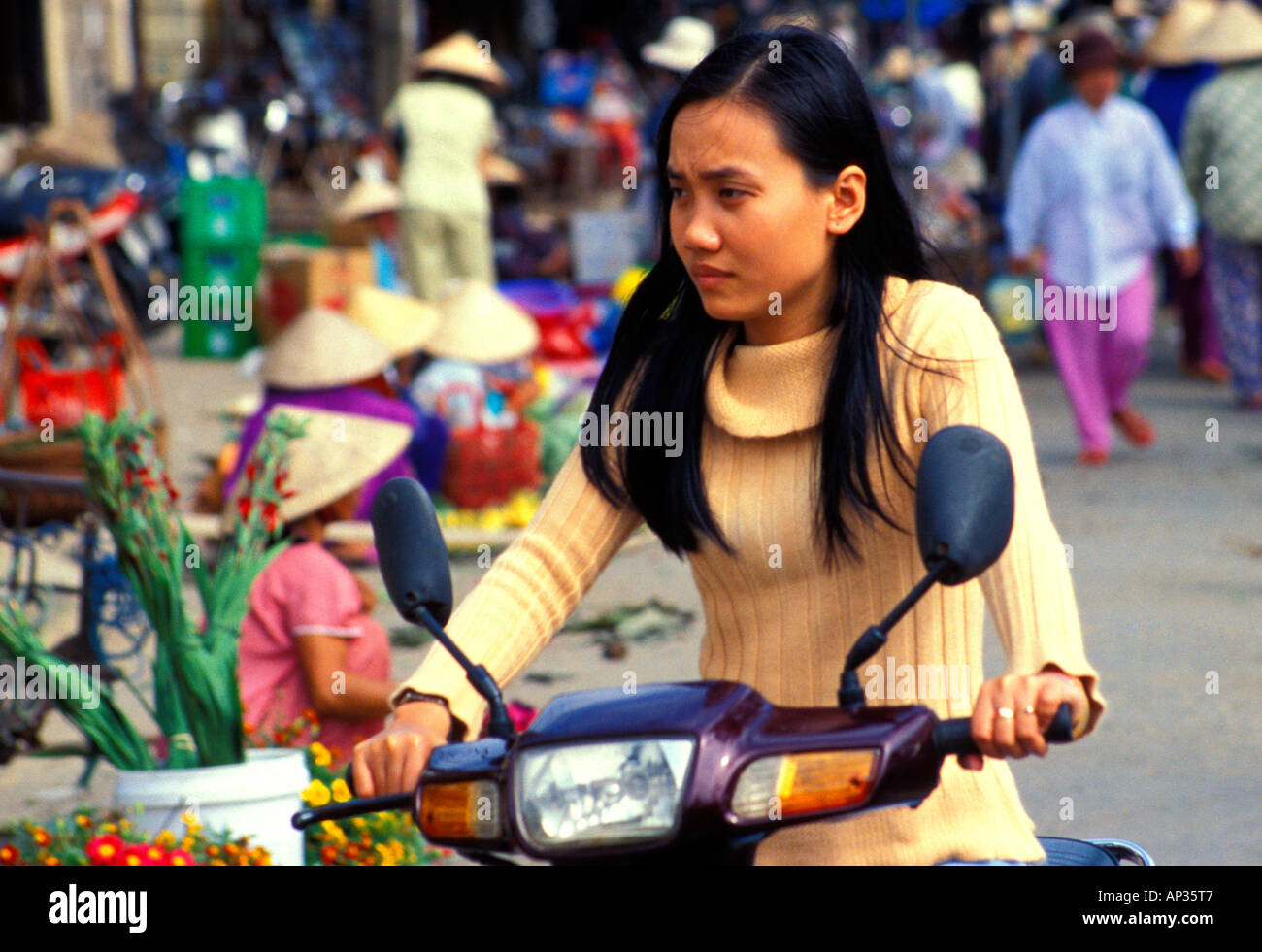 Vietnamese girl on scooter hi-res stock photography and images - Alamy