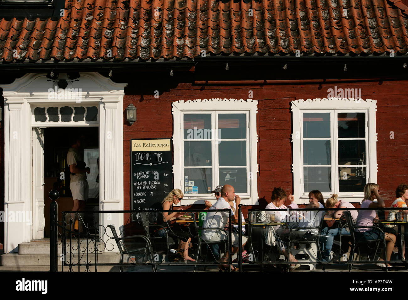 People sitting outside a street cafe, Kaffestugan, Visby, Gotland, Sweden Stock Photo