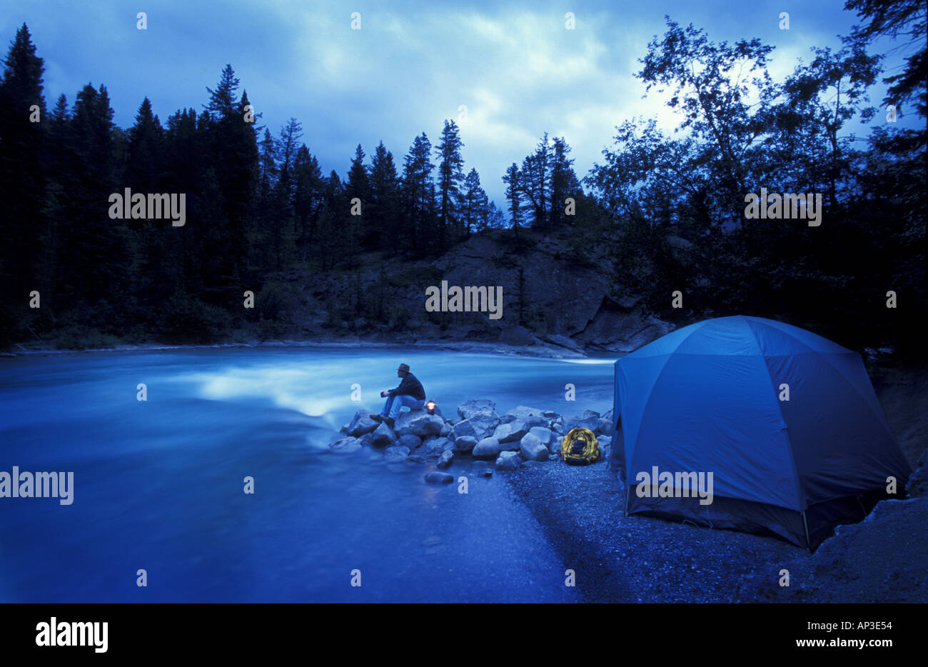Camper and tent by river Stock Photo - Alamy