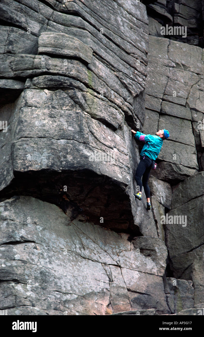 climber Mark Elliot rock climbing on Stanage Peak District National Park Derbyshire Stock Photo