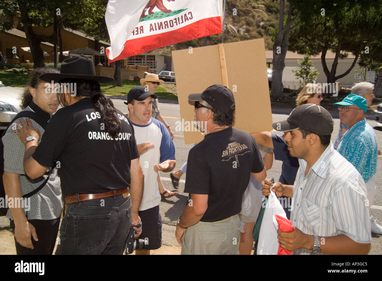 Pro- and anti-day laborer demonstrators argue at pro-day laborer demonstration at a hiring site in Laguna Beach, CA. Stock Photo