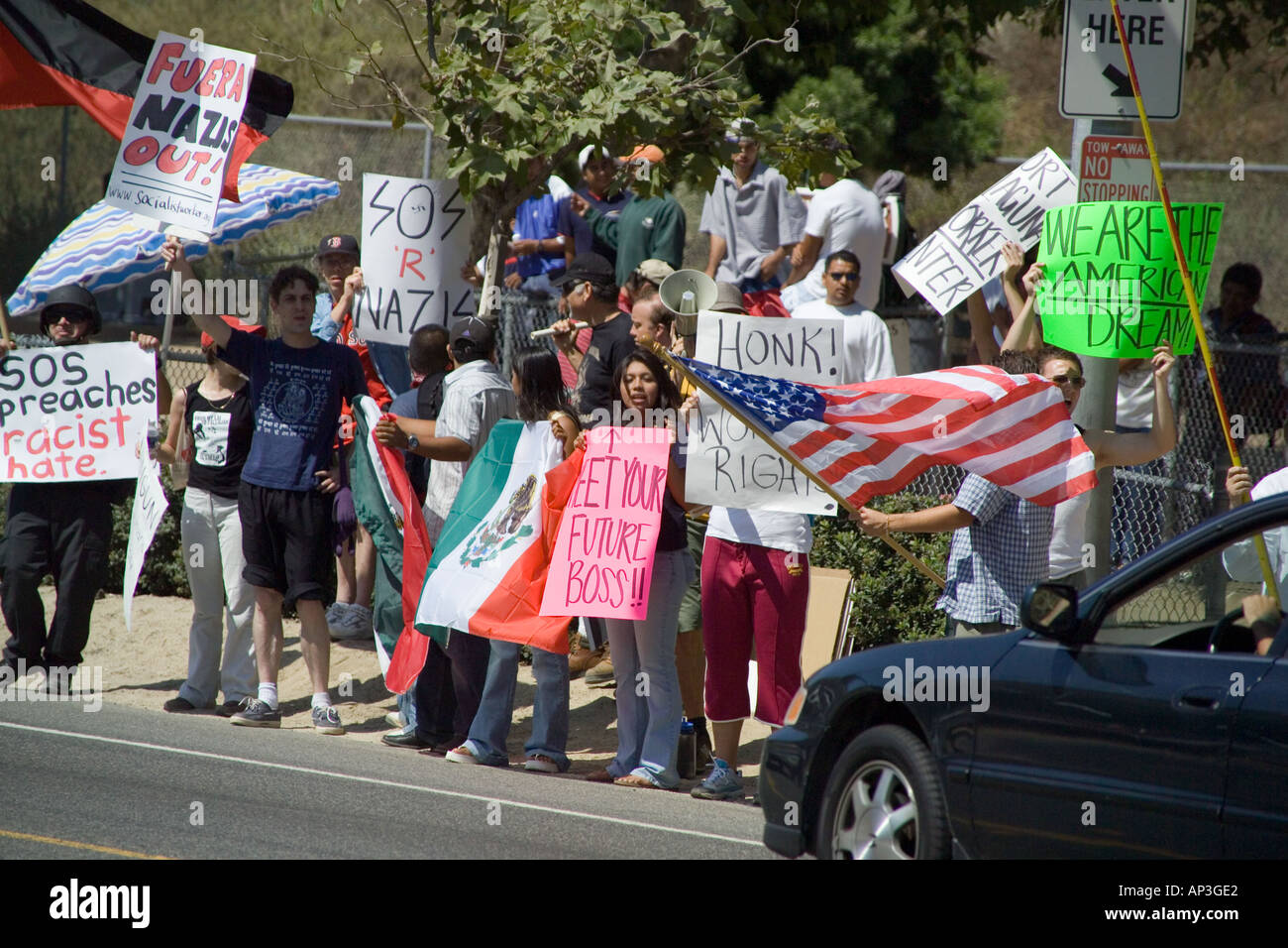 White & Hispanic demonstrators minority day laborers at a hiring center in Laguna Beach, CA. Stock Photo