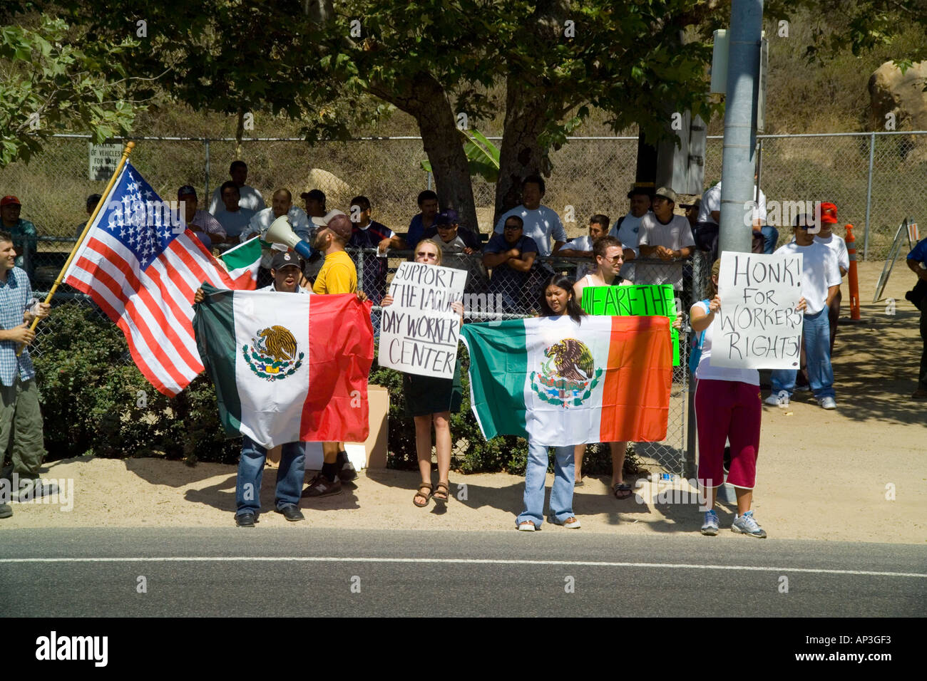 White & Hispanic demonstrators minority day laborers at a hiring center in Laguna Beach, CA. Stock Photo